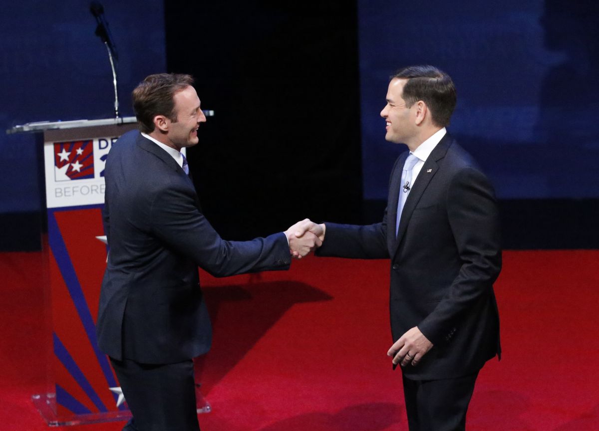 Rep. Patrick Murphy, left, and Sen. Marco Rubio shake hands before the start of a debate, Wednesday, Oct. 26, 2016, at Broward College in Davie, Fla. Rubio and Murphy held their second and final debate, 13 days before the election.