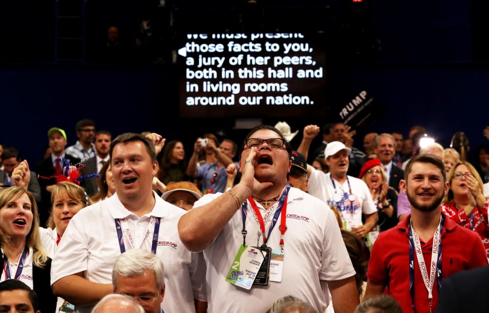A screen projects the speech of New Jersey Gov. Chris Christie as delegates participate during his talk on the second day of the Republican National Convention on July 19, 2016 at the Quicken Loans Arena in Cleveland, Ohio. (Getty)