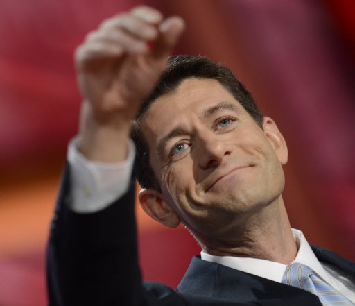 Paul Ryan gestures to GOP delegates after his address as the party's vice presidential nominee