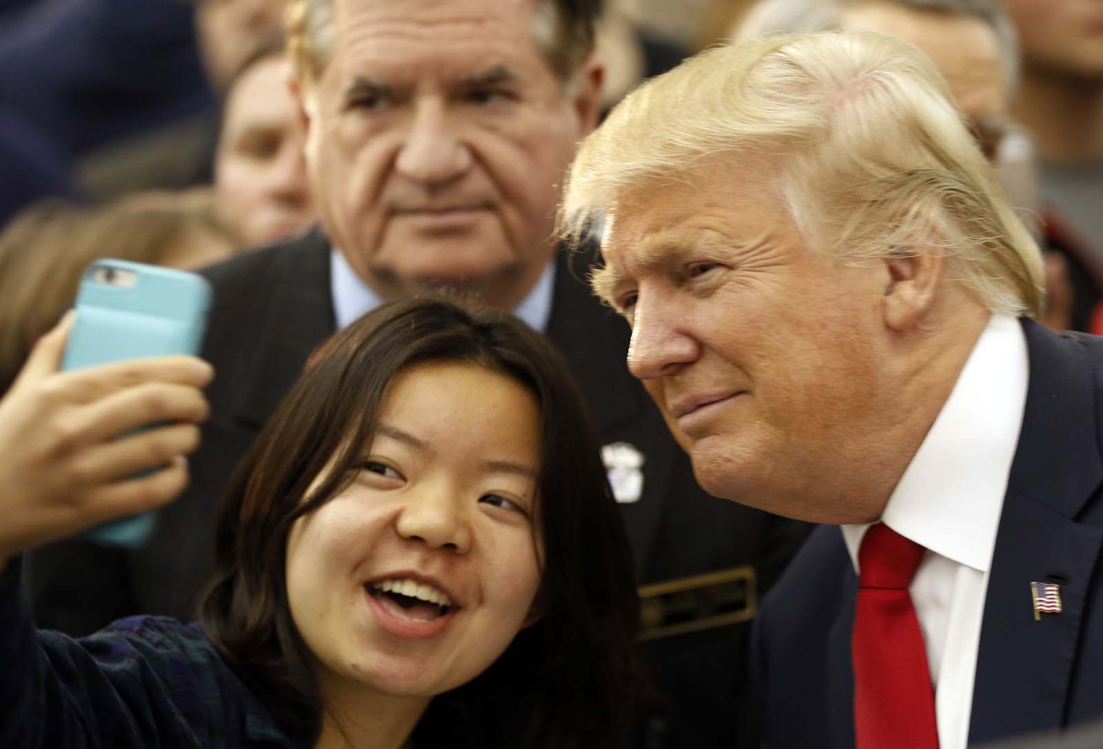 Republican presidential candidate Donald Trump poses for a photo during a campaign stop at the White Mountain Athletic Club Tuesday, Dec. 1, 2015, in Waterville Valley, N.H. (AP Photo/Jim Cole)
