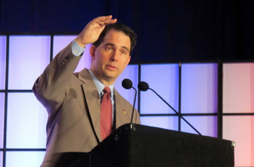 After months of calling a right to work measure for Wisconsin a "distraction," Gov. Scott Walker said he would sign a bill being fast-tracked to his desk.