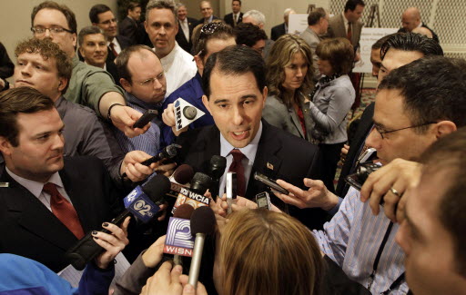 Gov. Scott Walker addresses the media after speaking to the Illinois Chamber of Commerce in Springfield, Ill.